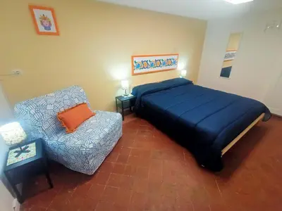 Letto o letti in una camera di Cuntintizza Family House