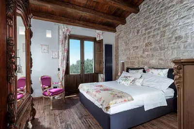Letto o letti in una camera di Corte Moscata