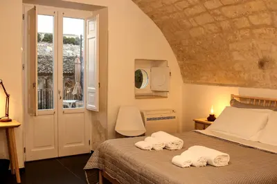 Letto o letti in una camera di Bed and Breakfast Terra del Sole Ibla