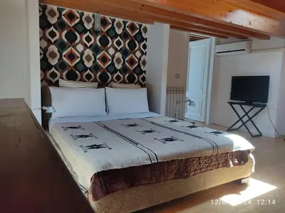 Letto o letti in una camera di Casa Montegrappa