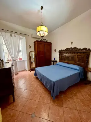 Letto o letti in una camera di Casa del Duomo