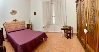 Letto o letti in una camera di Casa del Duomo