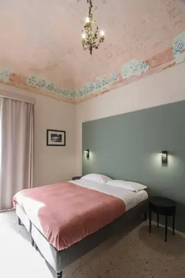 Letto o letti in una camera di Tre Vie apARTment 80