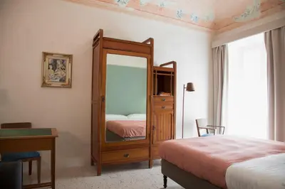 Letto o letti in una camera di Tre Vie apARTment 80