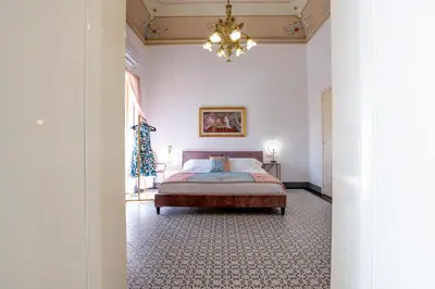 Letto o letti in una camera di Palazzo D'Arte - Luxury Home - Ragusa Centro