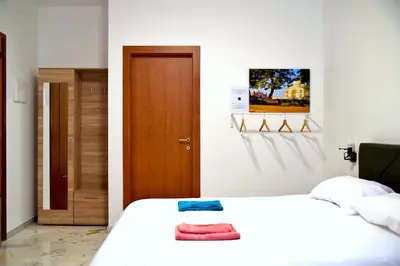 Letto o letti in una camera di Meraki Ortigia