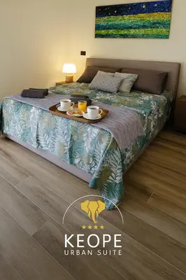 Letto o letti in una camera di Keope Urban Suite
