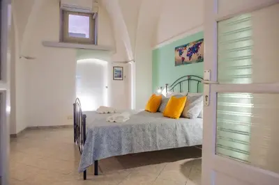 Letto o letti in una camera di Casa Vacanze - I Portici House