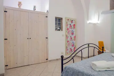 Letto o letti in una camera di Casa Vacanze - I Portici House