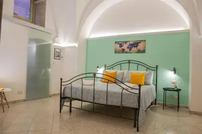 Letto o letti in una camera di Casa Vacanze - I Portici House