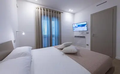 Letto o letti in una camera di VENTO DI GISIRA Luxury
