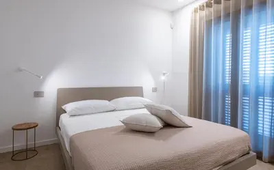Letto o letti in una camera di VENTO DI GISIRA Luxury