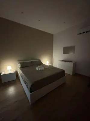Letto o letti in una camera di Le rose di Lu’