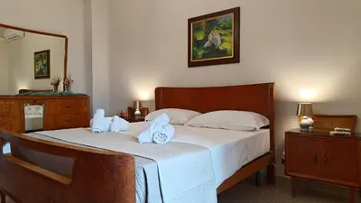 Letto o letti in una camera di Il Canto di Dafni, appartamento storico a Siracusa