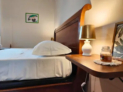 Letto o letti in una camera di Il Canto di Dafni, appartamento storico a Siracusa
