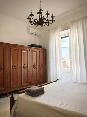 Letto o letti in una camera di Catania historical artist flat