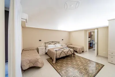 Letto o letti in una camera di BELLINIKATANESUITE