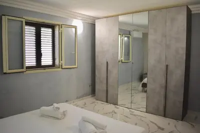 Letto o letti in una camera di Villa Caruso