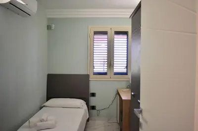 Letto o letti in una camera di Villa Caruso