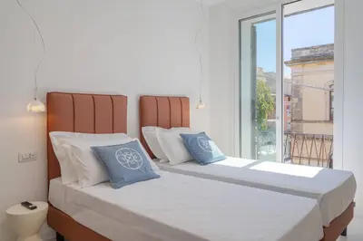 Letto o letti in una camera di Dimore delle Zagare Molo