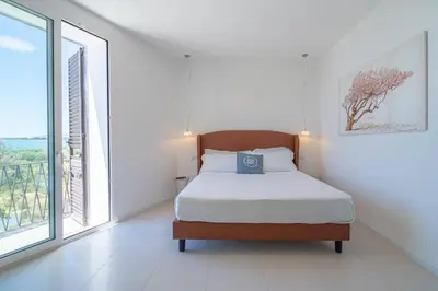 Letto o letti in una camera di Dimore delle Zagare Molo