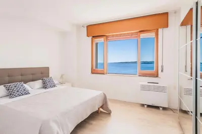 Letto o letti in una camera di Una Finestra Su Cala Rossa by Wonderful Italy