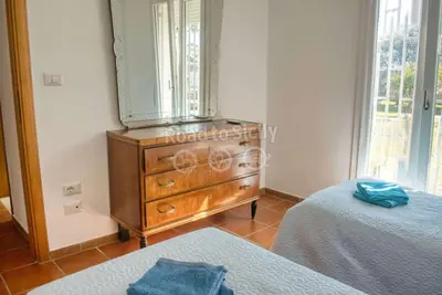 Letto o letti in una camera di Aleari Villa Fanusa