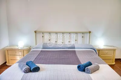Letto o letti in una camera di Aleari Villa Fanusa