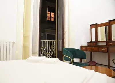 Letto o letti in una camera di LN B&B CATANIA