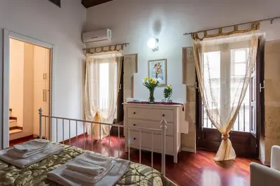 Letto o letti in una camera di Relax apartment - Ortigia Holidays