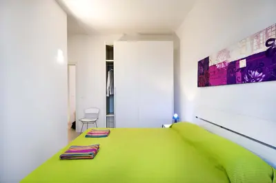 Letto o letti in una camera di Villa Capo Passero