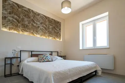 Letto o letti in una camera di Villa Domus Sicilia - Charming Living