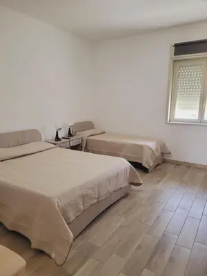 Letto o letti in una camera di HOUSE AIRPORT Catania