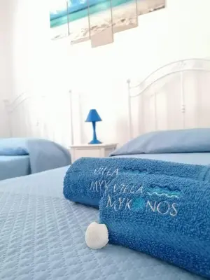 Letto o letti in una camera di Villa Mykonos