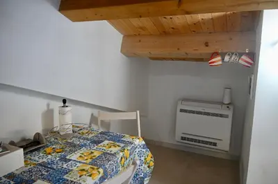 Letto o letti in una camera di Mare Arcobaleno