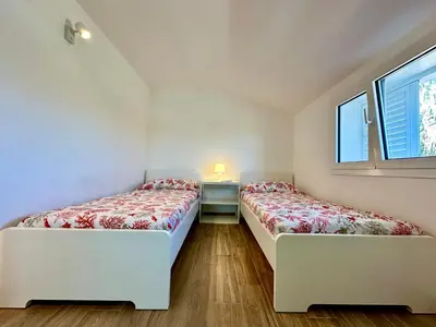 Letto o letti in una camera di Villa Zaffiri 94