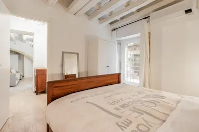 Letto o letti in una camera di Il Cortile sul Vicolo alla Giudecca by Wonderful Italy