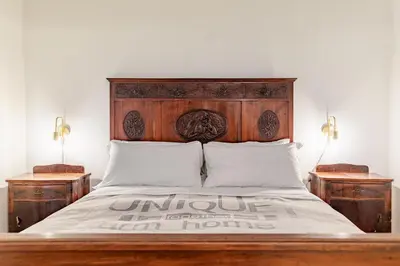 Letto o letti in una camera di Il Cortile sul Vicolo alla Giudecca by Wonderful Italy