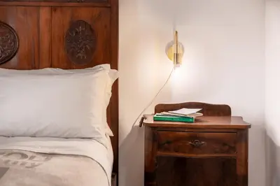 Letto o letti in una camera di Il Cortile sul Vicolo alla Giudecca by Wonderful Italy
