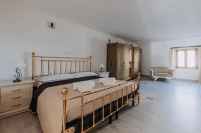 Letto o letti in una camera di Tramonto vista mare
