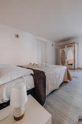 Letto o letti in una camera di Tramonto vista mare