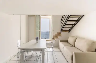 Area soggiorno di Fronte Mare Apartments & City Views