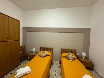 Letto o letti in una camera di Casa Vacanza le 2 Sorelle