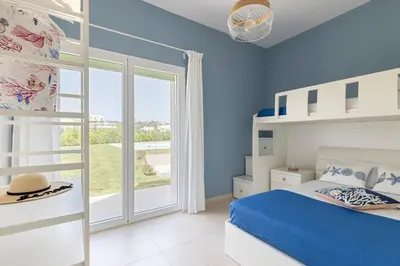 Letto o letti in una camera di Casa de Mar