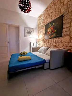 Letto o letti in una camera di Casa Vacanze Le Giuseppine