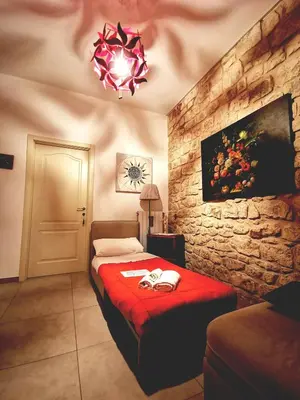 Letto o letti in una camera di Casa Vacanze Le Giuseppine