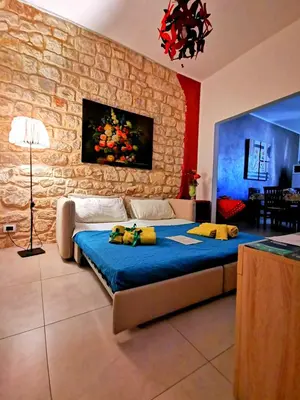 Letto o letti in una camera di Casa Vacanze Le Giuseppine