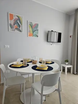 TV o dispositivi per l'intrattenimento presso Bilocale in resort con piscine