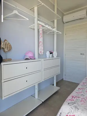 Letto o letti in una camera di Bilocale in resort con piscine
