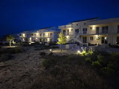 Giardino di Bilocale in resort con piscine